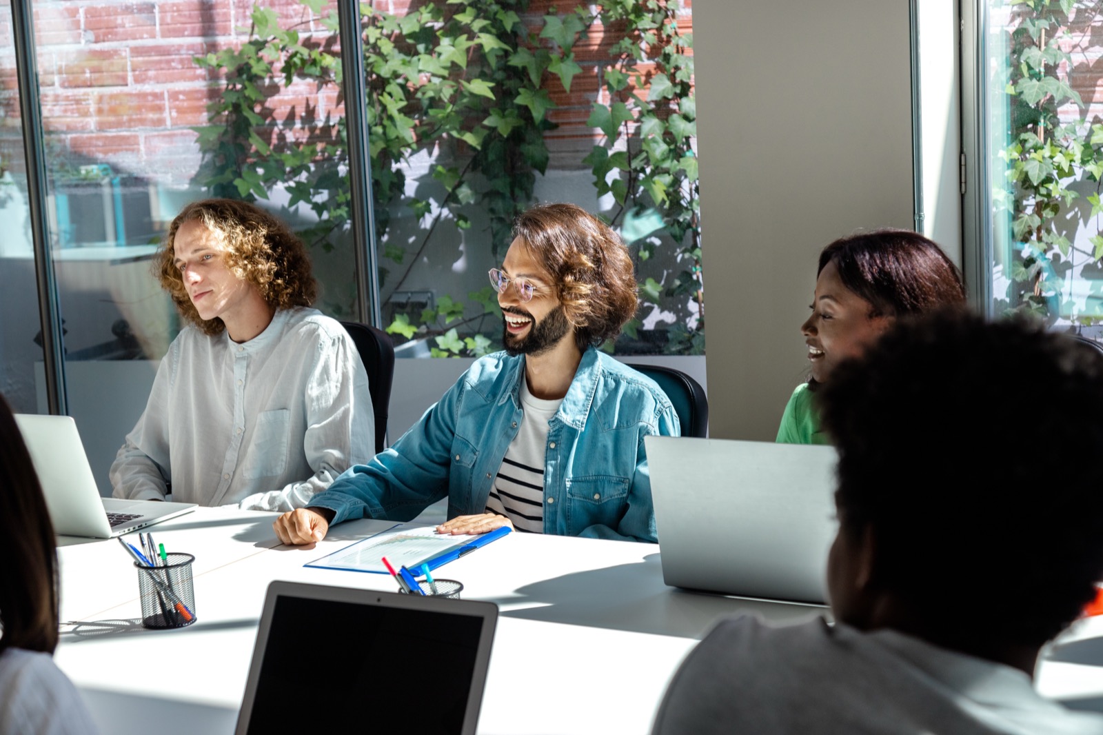Team collaborating with AI tools